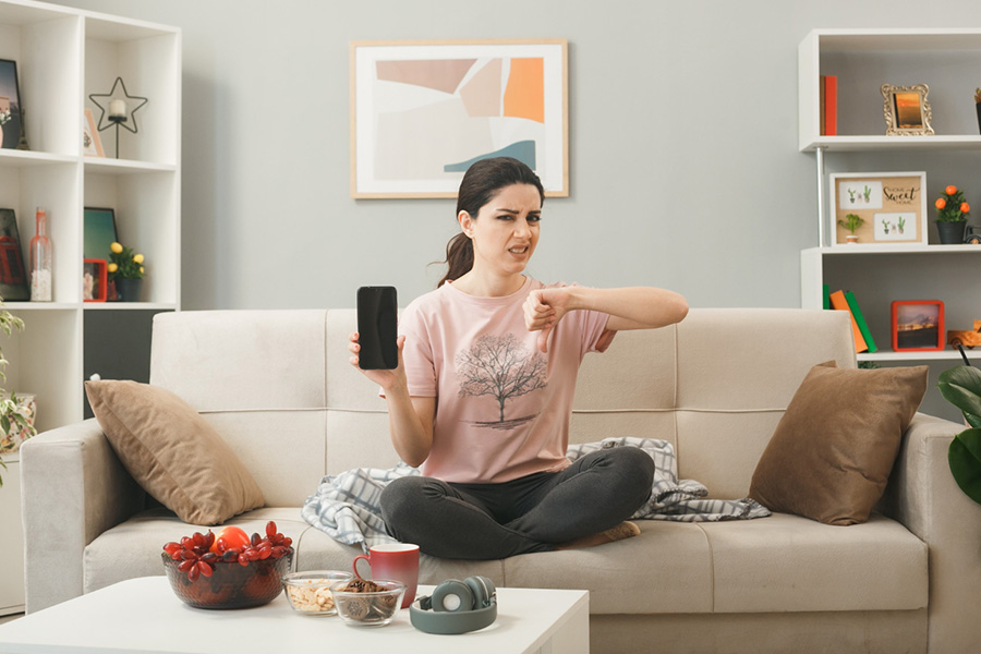 How Do Information and Communication Technologies (ICTs) Affect National Well-Being? The Contrasting Influence of Mobile Phones and Household Computers